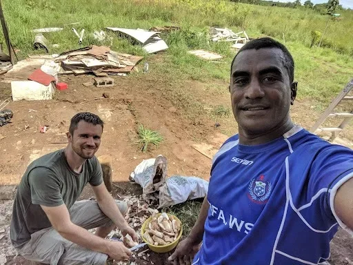 Tyler and Iliesa Fonolahi at a cleanup service project in Fiji