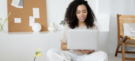 Young professional woman scrolling on her laptop: Ever Accountable: How ADHD diagnosis can increase vulnerability to porn addiction